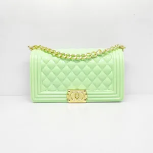 Mint green quilted jelly shoulder bag with gold chain and chic clasp for women daily wear.