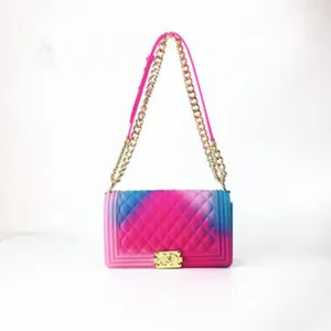 Detailed view of the gradient silicone quilted shoulder bag, showing hardware lock and chain.