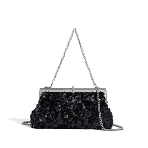 Detailed view of the elegant black sequin evening clutch bag with silver chain strap and frame.