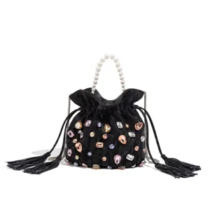 Black velvet rhinestone bucket bag detail, luxury pearl handle and crystal embellishments.