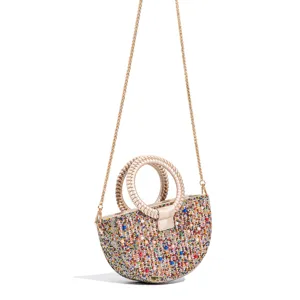 Elegant half-moon crystal evening bag with pearls, braided handles, and chic chain strap.