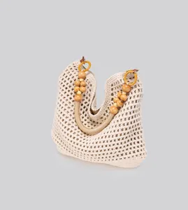 Handmade crochet cotton tote bag with unique wooden bead handles for casual beach summer vacation.