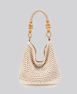 Chic beige crochet hobo shoulder bag with wooden bead handle, perfect for beach vacation.
