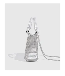 Detailed side view of the sparkling rhinestone evening handbag showing exquisite craftsmanship.