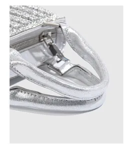 Silver rhinestone evening bag metal handle hardware and zipper detail close up view