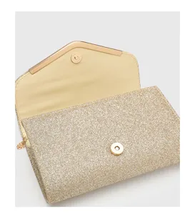 Elegant glitter evening clutch bag with chain strap and magnetic snap closure for parties.