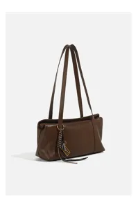 Detailed view of the retro brown women's shoulder underarm bag with long straps and charm.
