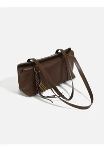 Brown retro women shoulder underarm bag detail view, classic leather texture and chic strap design.