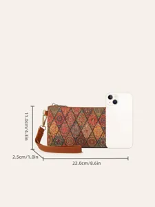 Detail view of retro bohemian printed clutch bag showing compact size and wrist strap design.