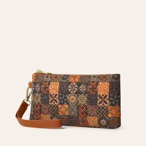 Bohemian printed cork clutch wallet for women, stylish zipper coin purse with brown wrist strap.