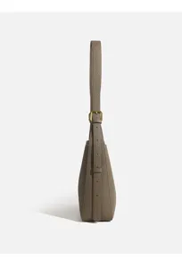 Side detail view of the stylish taupe leather shoulder bag, premium pebbled texture.