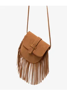 Detail view of brown faux suede crossbody bag with retro western fringe and shoulder strap.