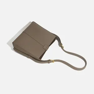Taupe leather shoulder bag for women, stylish large capacity commuter crossbody bag.