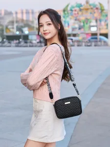 Stylish black quilted shoulder crossbody bag with trendy printed strap for women daily wear.