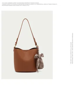Brown bucket bag for women, stylish large capacity shoulder handbag with scarf accessory.