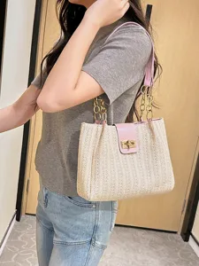 Stylish women's straw woven shoulder bag with pink trim and chain, large capacity tote.