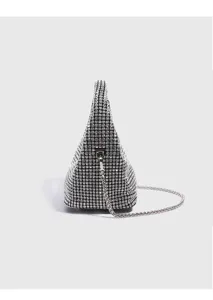 Close-up detail view of the sparkling rhinestone triangular handbag with metal chain strap.