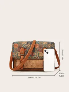 Vintage crossbodytas van kurk met geometrische print en verstelbare bruine band.