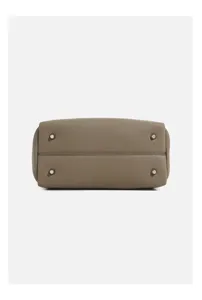 Detail view of the premium pebbled leather handbag bottom with metal protective feet.