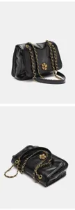 Black shoulder bag with gold chain strap and flower clasp, perfect for daily commute and style.