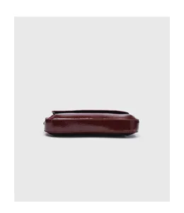 Dark red patent leather baguette underarm bag bottom and side structural detail view.