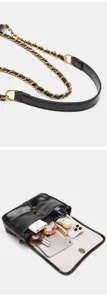Bag detail view showing the exquisite chain strap and spacious interior capacity for daily essentials.