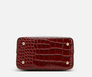Burgundy patent leather crocodile texture bucket bag bottom detail, high quality women bag.