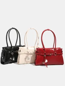 Stylish patent leather shoulder bag for women, trendy motorcycle style handbag with belt design.