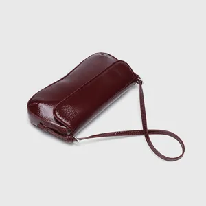 Burgundy patent leather baguette shoulder bag, minimalist flap underarm chic elegant bag.