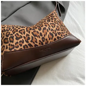 Leopard print shoulder bag for women, stylish underarm handbag with brown leather trim.