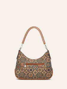 Detailed view of ethnic cork shoulder bag with geometric print, woven chain strap and zipper.