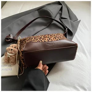 Leopard print shoulder bag with cute teddy bear pendant, stylish autumn winter handbag.
