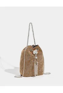 Sparkling rhinestone bucket bag with chain strap and crystal tassel. Elegant evening purse.