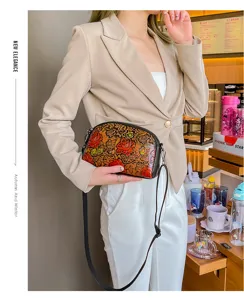Vintage floral embossed leather crossbody bag, artistic hand-painted retro shoulder bag for women.