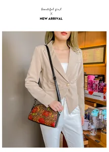 Retro ethnic hand-painted embossed leather shoulder crossbody bag for women daily fashion style.