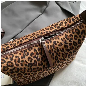 Leopard print plush shoulder bag for women, stylish suede handbag with zipper closure.
