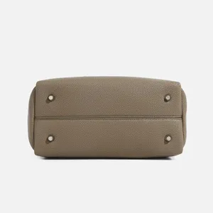 Taupe leather top-handle handbag bottom view, elegant everyday versatile crossbody bag style.
