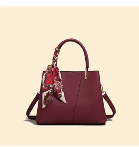 Burgundy leather handbag for women, large capacity tote bag with elegant floral twilly scarf.