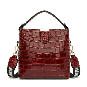 Red patent leather crocodile pattern bucket bag for women, stylish casual shoulder bag.