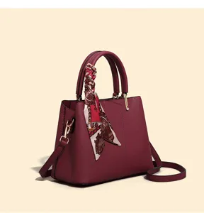 Wine red large capacity handbag with decorative scarf, elegant shoulder crossbody bag.