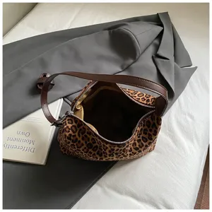 Leopard print hobo shoulder bag detailed view, trendy fuzzy texture with brown strap.