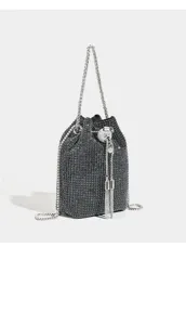 Sparkling rhinestone bucket bag detail, shimmering mesh texture with elegant chain strap.