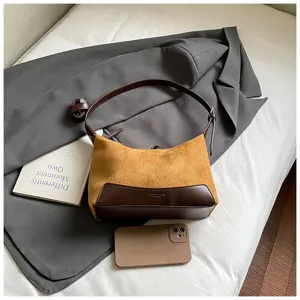 Brown suede and leather hobo shoulder bag detail view, showing exquisite texture and stitching.