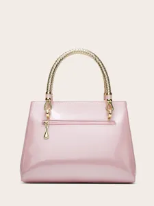 Elegant pink patent leather handbag featuring a chic gold braided top handle and polished hardware.
