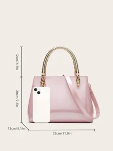 Pink patent leather handbag with gold braided top handle, elegant tote bag detail view.