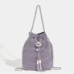 Sparkling purple rhinestone bucket bag with silver chain strap and chic tassels.