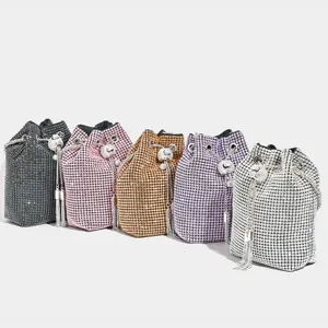 Sparkling rhinestone bucket bag with tassel crossbody design for women evening party.