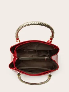 Red patent leather tote bag with metallic braided handles and spacious multi-compartment.