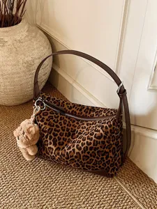 Leopard print shoulder bag with cute plush puppy charm, stylish large capacity hobo bag.