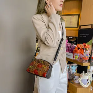 Vintage ethnic handmade embossed leather shoulder crossbody bag for women, stylish daily use.